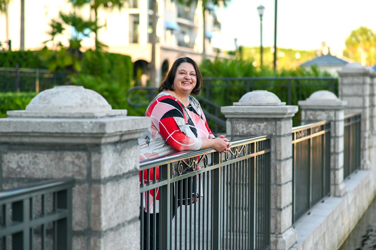 Amanda standing at a railing on the Riviera