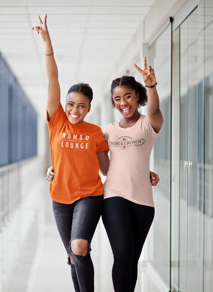 two women wearing shirts for disney bars